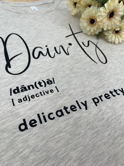 Womens graphic tee with the definition of dainty on it with flowers in the corner