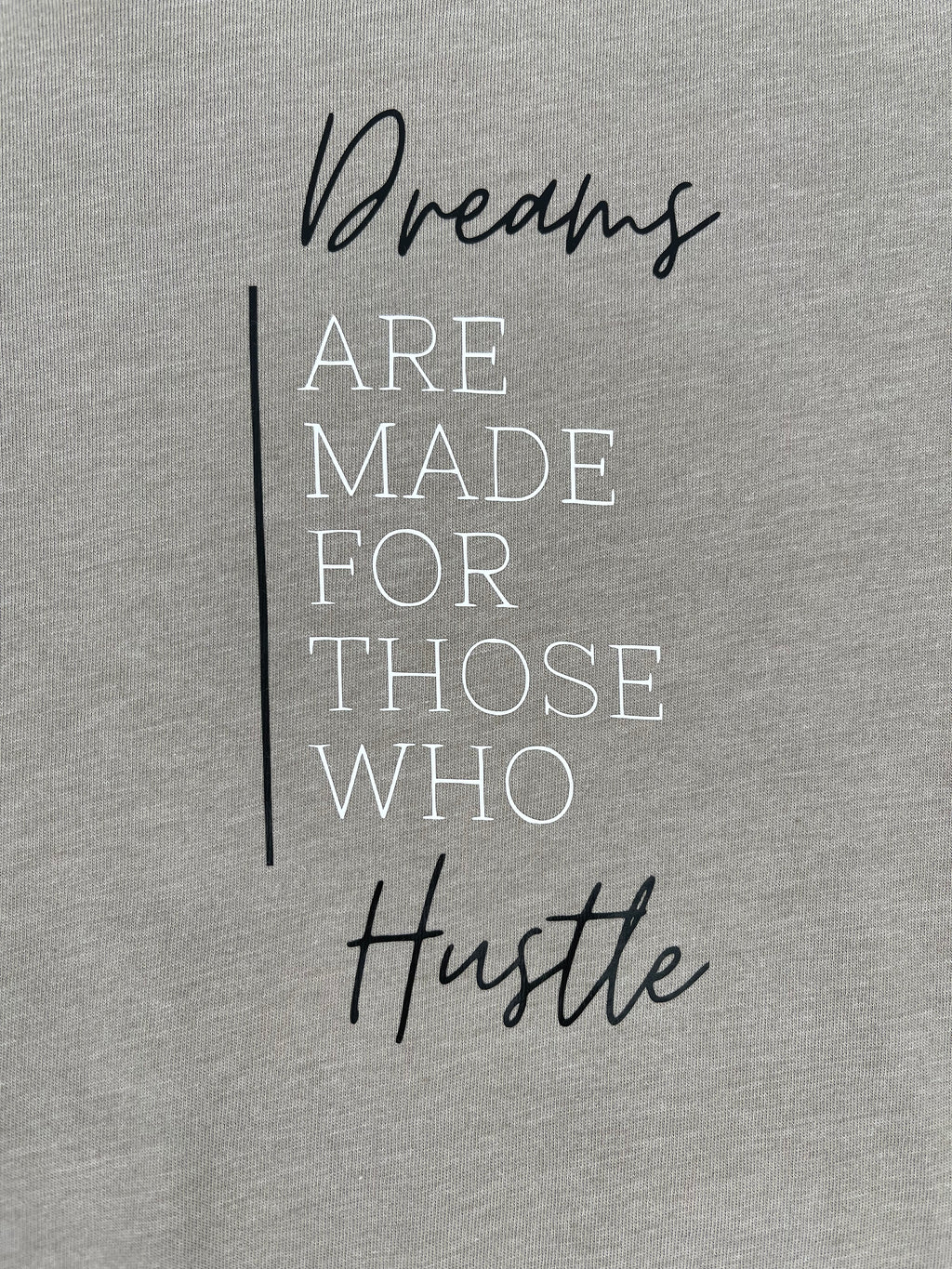 dreams are made for those who hustle quote on a beige background