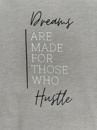 dreams are made for those who hustle quote on a beige background